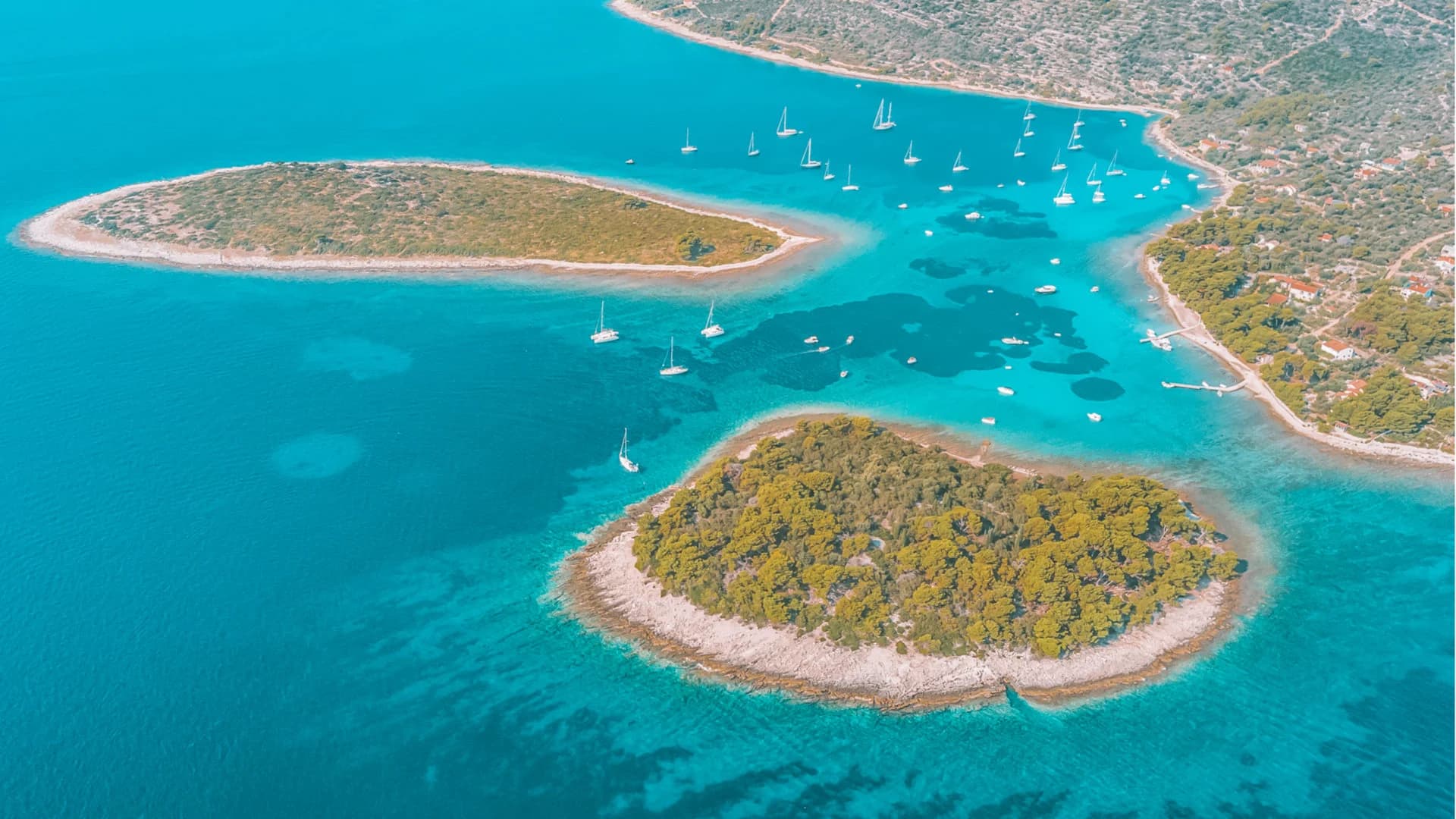 The Blue Lagoon at Krknjaši, sailing boats anchored in the shallow turquoise channel — Blue Lagoon & Trogir — Half Day
