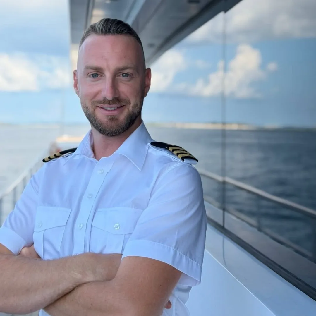 Ivan, one of the two brothers who run the boats, in uniform aboard a motor yacht. Ivan