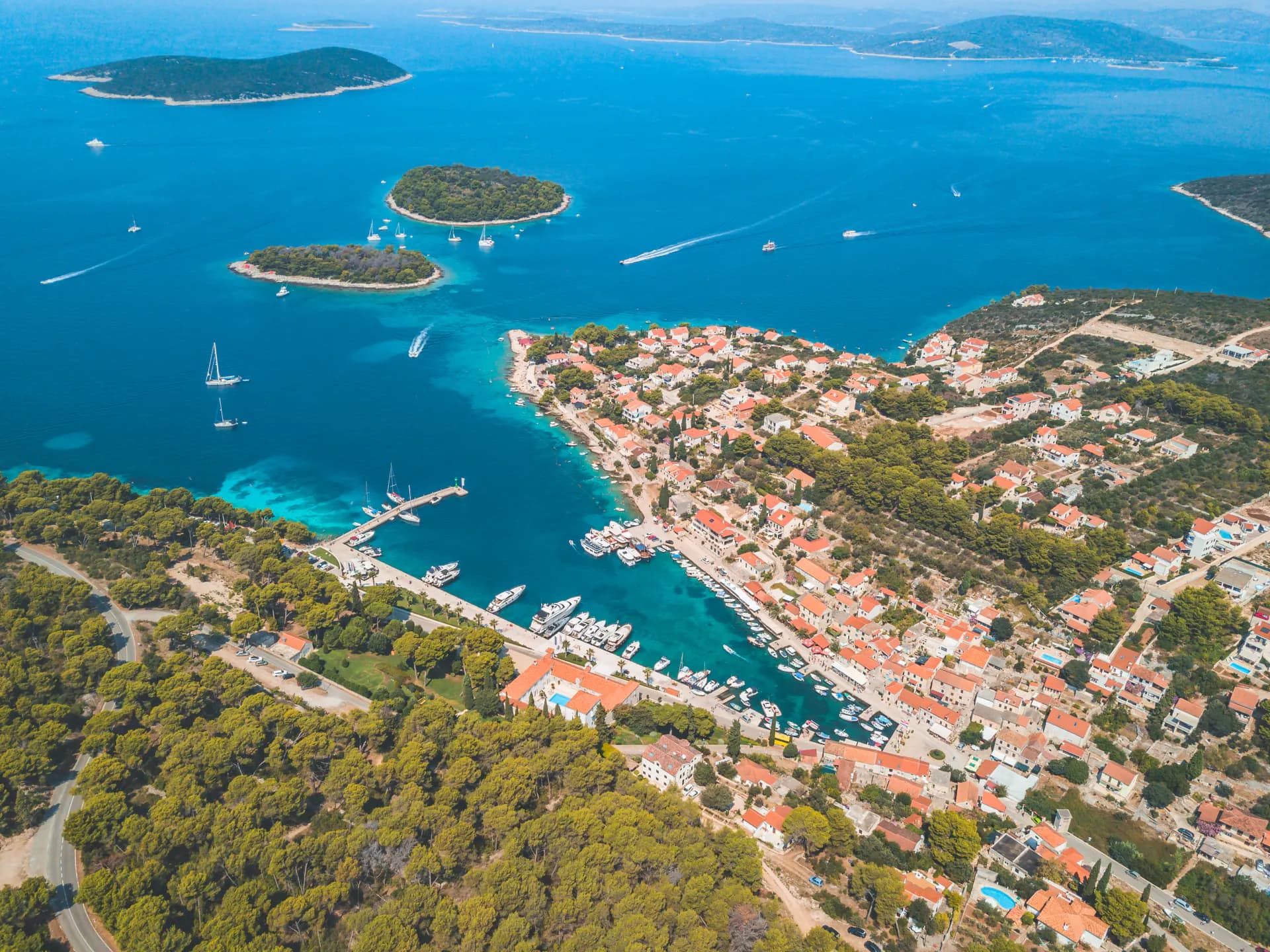 Maslinica on Šolta and the seven islets off its harbour, from the air — Blue Lagoon & Trogir — Private